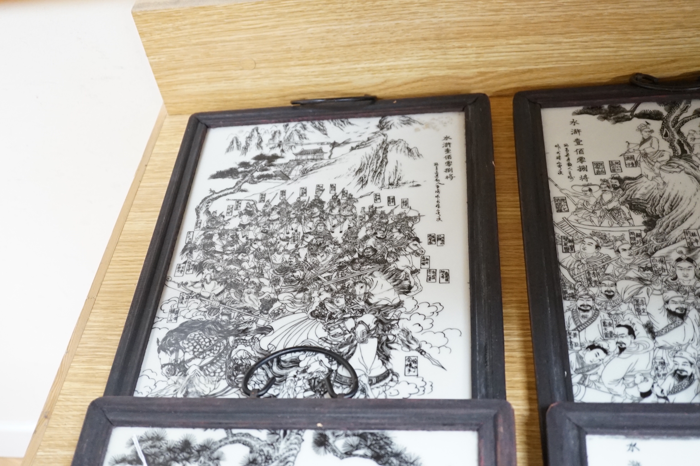 A set of 4 transfer printed Chinese plaques, 28.5cm x 40cm